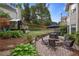 Backyard featuring an outdoor seating area with fire pit, playhouse, patio area and mature landscaping at 1199 Kenway Se Cir, Smyrna, GA 30082