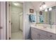 Well-lit bathroom features a white vanity, framed mirror, towel rack, and a separate toilet and shower area at 1199 Kenway Se Cir, Smyrna, GA 30082