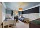 Charming bedroom featuring two twin beds, blue walls and a chalkboard accent wall at 1199 Kenway Se Cir, Smyrna, GA 30082