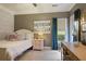 Cozy bedroom with a comfortable bed, natural light, and a desk area for work or study at 1199 Kenway Se Cir, Smyrna, GA 30082