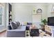 Comfortable bonus room with a large sectional sofa, modern decor, and a cozy ambiance, ideal for Gathering gatherings at 1199 Kenway Se Cir, Smyrna, GA 30082