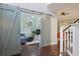 Bonus room featuring hardwood floors, barn doors, comfortable seating, and stylish decor, perfect for relaxation at 1199 Kenway Se Cir, Smyrna, GA 30082