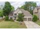 Charming two-story home featuring a well-manicured lawn, two-car garage, and inviting curb appeal in a lush, green neighborhood at 1199 Kenway Se Cir, Smyrna, GA 30082
