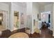 Entry hall with wood floors leads to charming spaces, showcasing the home's unique character and design at 1199 Kenway Se Cir, Smyrna, GA 30082