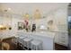 Well-lit kitchen with white cabinets, an island with seating, and modern stainless steel appliances at 1199 Kenway Se Cir, Smyrna, GA 30082