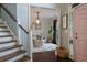 Charming living room featuring a staircase, stylish furniture, and an open layout, creating a welcoming and comfortable atmosphere at 1199 Kenway Se Cir, Smyrna, GA 30082