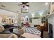 Open-concept living room showcases a stone fireplace, stylish decor, and seamless flow to the kitchen at 1199 Kenway Se Cir, Smyrna, GA 30082