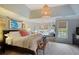 A bright main bedroom with large windows, bench, and a stylish rug at 1199 Kenway Se Cir, Smyrna, GA 30082