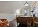 Attic office space boasts a large wooden desk, hardwood floors, natural light, and lots of room for storage at 1199 Kenway Se Cir, Smyrna, GA 30082