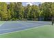 Close up view of community tennis court surrounded by trees and a sign that reads 'King Valley' at 1199 Kenway Se Cir, Smyrna, GA 30082