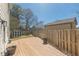 Wooden back deck offers a view of the fenced backyard and storage shed at 1303 Hill Se St, Atlanta, GA 30315