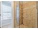 Modern tiled shower with glass door near a bright window in this updated bathroom at 1303 Hill Se St, Atlanta, GA 30315