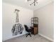 Bedroom with giraffe wall art, black office chair, and wood shelf at 1303 Hill Se St, Atlanta, GA 30315