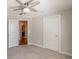 Carpeted bedroom with ceiling fan and white paneled doors leading to the rest of the house at 1303 Hill Se St, Atlanta, GA 30315