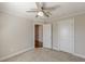 This bedroom features neutral carpet, modern ceiling fan and access to other rooms via white doors at 1303 Hill Se St, Atlanta, GA 30315