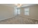 A well-lit bedroom featuring two windows and neutral carpeting at 1303 Hill Se St, Atlanta, GA 30315