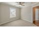 Neutral bedroom featuring a ceiling fan and a window with white trim at 1303 Hill Se St, Atlanta, GA 30315