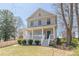 Inviting two-story home with a cozy front porch and lush green lawn at 1303 Hill Se St, Atlanta, GA 30315