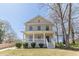 Charming two-story home features a welcoming front porch, manicured lawn and an inviting exterior at 1303 Hill Se St, Atlanta, GA 30315