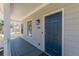 Charming front porch featuring a blue front door, overhead light, and spacious entryway at 1303 Hill Se St, Atlanta, GA 30315