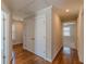 Hallway with hardwood floors, closet space and neutral paint at 1303 Hill Se St, Atlanta, GA 30315