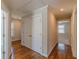 Upstairs hallway boasts hardwood floors, access to rooms and large storage closet at 1303 Hill Se St, Atlanta, GA 30315