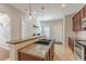 Kitchen featuring a granite countertop island, stainless steel appliances, and neutral colors at 1303 Hill Se St, Atlanta, GA 30315