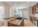 Modern kitchen with granite counters, dark wood cabinetry, and open access to other living spaces at 1303 Hill Se St, Atlanta, GA 30315