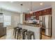 Bright kitchen island with stainless steel appliances, granite countertops, and bar stool seating at 1303 Hill Se St, Atlanta, GA 30315