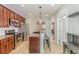 A kitchen with dark wood cabinets, stainless steel appliances, granite countertops, and an island with bar seating at 1303 Hill Se St, Atlanta, GA 30315