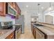 A kitchen featuring stainless steel appliances and granite countertops, complemented by wooden cabinetry at 1303 Hill Se St, Atlanta, GA 30315