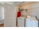 Laundry room featuring a washer, dryer and shelving for storage at 1303 Hill Se St, Atlanta, GA 30315
