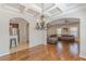 Open-concept layout with hardwood flooring, leading from kitchen to a comfortable living space at 1303 Hill Se St, Atlanta, GA 30315