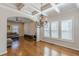 Living room with coffered ceilings, large windows, hardwood floors and comfortable seating at 1303 Hill Se St, Atlanta, GA 30315