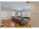 Living room with hardwood floors, a large sofa, and a ceiling fan at 1303 Hill Se St, Atlanta, GA 30315