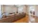 Spacious living room featuring hardwood floors, gray sectional sofa, and archway into other rooms at 1303 Hill Se St, Atlanta, GA 30315