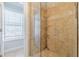 The tiled shower features a clear glass door and convenient shelving at 1303 Hill Se St, Atlanta, GA 30315