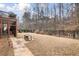 Expansive backyard with lush lawn, framed by a classic black metal fence and mature trees, ideal for outdoor enjoyment at 1525 Camden Cove Dr, Cumming, GA 30040