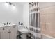 Bathroom featuring a sink, toilet and shower with a patterned curtain at 1525 Camden Cove Dr, Cumming, GA 30040