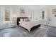 Bedroom featuring large windows, gray floors, neutral walls and minimal decor at 1525 Camden Cove Dr, Cumming, GA 30040