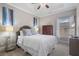 Bedroom with light gray walls, a bed with white linens, and windows for natural light at 1525 Camden Cove Dr, Cumming, GA 30040