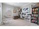Bedroom features a hanging swing chair, artwork and shelving for books and décor, with a large window at 1525 Camden Cove Dr, Cumming, GA 30040