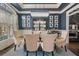 Stunning dining room with a modern chandelier, glass table and plenty of natural light at 1525 Camden Cove Dr, Cumming, GA 30040