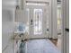 Inviting foyer with stained glass front door, neutral walls and blue patterned rug at 1525 Camden Cove Dr, Cumming, GA 30040