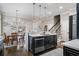 Modern kitchen with dark cabinets, a white countertop island, and stainless steel appliances at 1525 Camden Cove Dr, Cumming, GA 30040