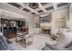 Open concept living room showcases a fireplace, built-in shelving, and views into the eat-in kitchen at 1525 Camden Cove Dr, Cumming, GA 30040