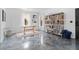 Open concept bonus room with gray floors, neutral walls, a table and shelving for books and décor at 1525 Camden Cove Dr, Cumming, GA 30040