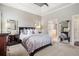 Comfortable main bedroom with a large bed and view into the ensuite bathroom at 1525 Camden Cove Dr, Cumming, GA 30040