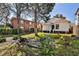 Spacious backyard area with gravel, grass, landscaping and a wooden privacy fence at 32 Howell Se St, Atlanta, GA 30312