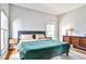 Spacious bedroom with ample natural light, neutral tones, and sleek furnishings offers a peaceful retreat at 32 Howell Se St, Atlanta, GA 30312